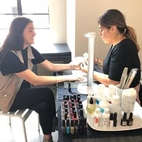 Professional manicure service at a Pamper Perfect event