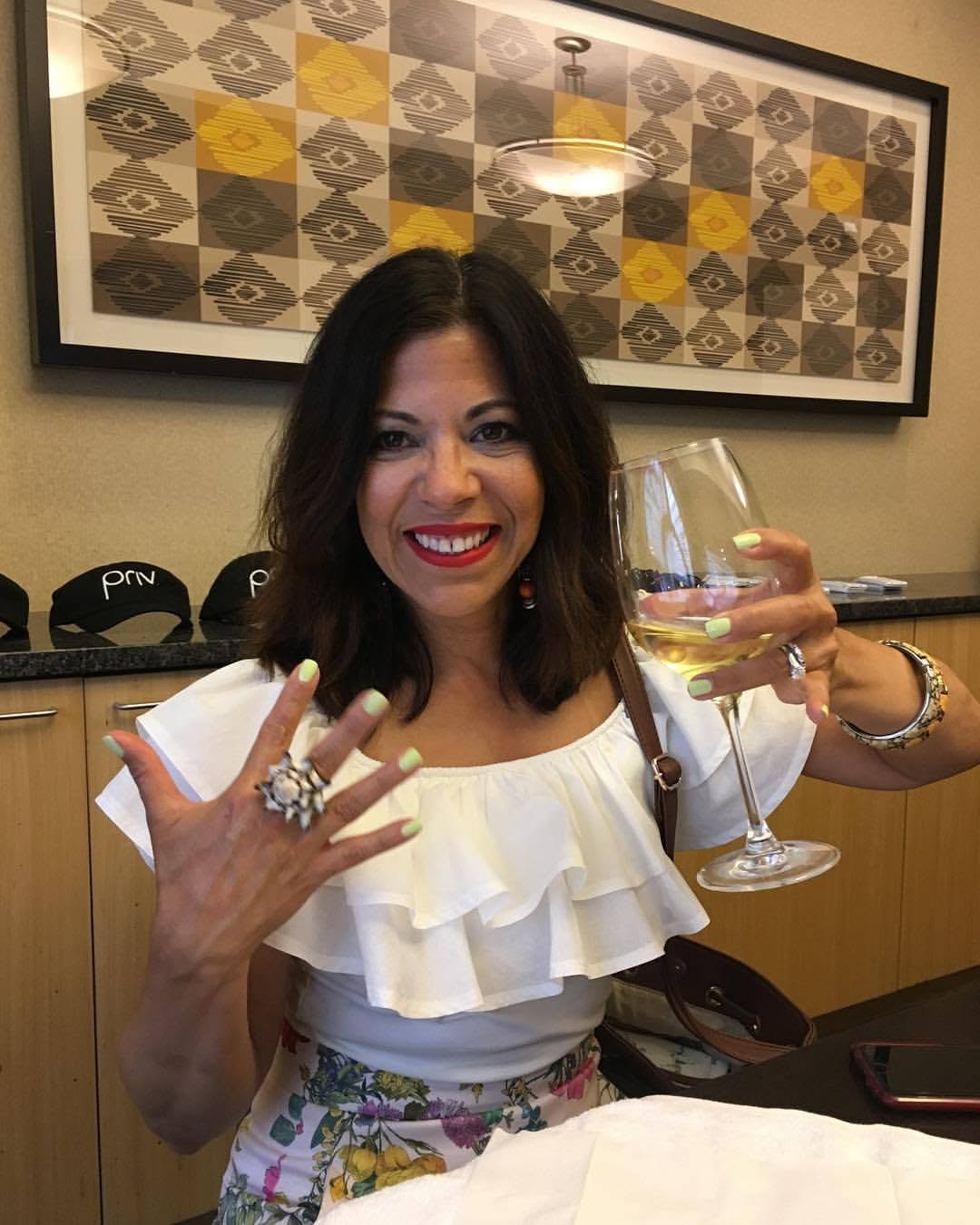 Happy guest showing fresh nails at a Pamper Perfect spa party